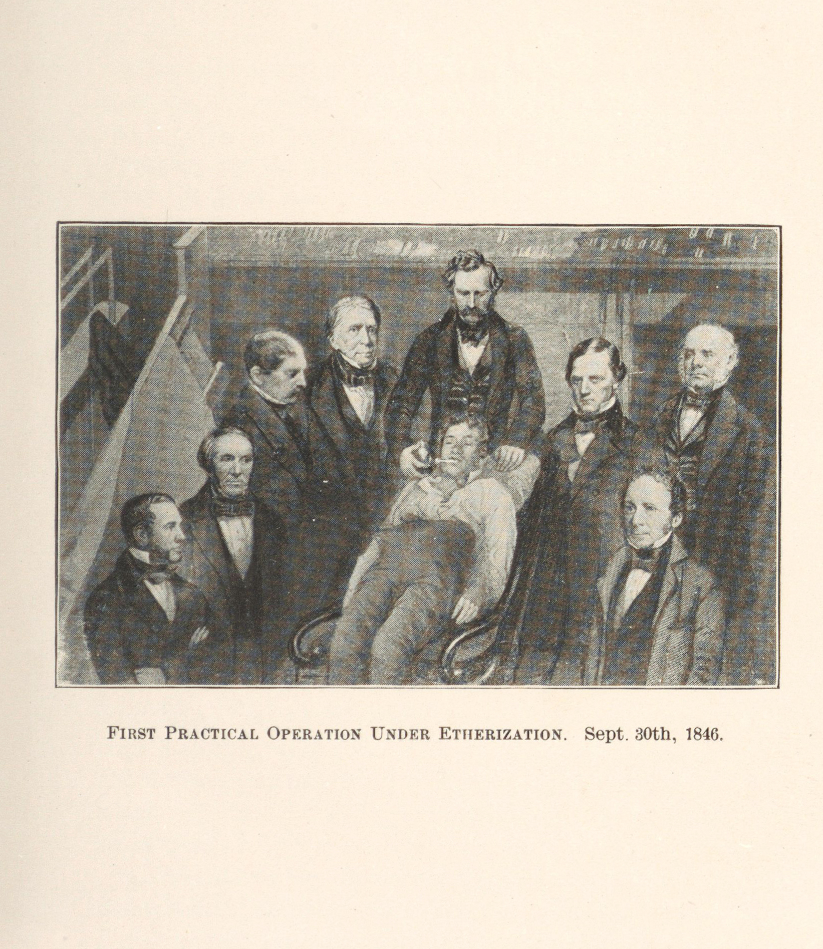 Men gather around a man lying in a chair