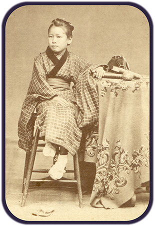 Seated portrait photo of Yasu Hishikawa, circa 1871